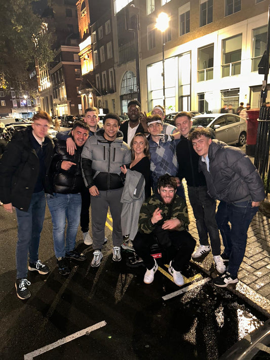 a group of people in london after a night out